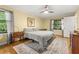This bedroom features a decorative rug, ceiling fan, and a neutral decor at 2144 Pinopolis Rd, Pinopolis, SC 29469