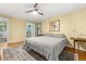This bedroom features a ceiling fan, closet, and neutral decor at 2144 Pinopolis Rd, Pinopolis, SC 29469