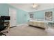 Bedroom with blue walls, carpet, ceiling fan, two windows, and a bed at 2144 Pinopolis Rd, Pinopolis, SC 29469