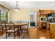 A round dining table is the center of the space and offers outside views from the large window at 2144 Pinopolis Rd, Pinopolis, SC 29469