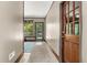 Inviting hallway with neutral walls, tiled floors, and a view to the outside at 2144 Pinopolis Rd, Pinopolis, SC 29469