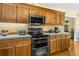 Traditional kitchen with wooden cabinets, modern stainless steel appliances, and light blue countertops at 2144 Pinopolis Rd, Pinopolis, SC 29469