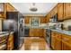 Charming kitchen featuring wooden cabinets, black appliances, and durable countertops at 2144 Pinopolis Rd, Pinopolis, SC 29469