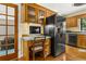 This kitchen features wooden cabinets, a computer station, and a modern refrigerator at 2144 Pinopolis Rd, Pinopolis, SC 29469