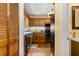 Efficient kitchen layout featuring wooden cabinets, stainless steel appliances, and hardwood floors at 2144 Pinopolis Rd, Pinopolis, SC 29469
