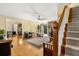 Cozy living room with hardwood floors, a fireplace, and open access to other living spaces at 2144 Pinopolis Rd, Pinopolis, SC 29469