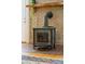 The living room has a tile fireplace with a wood mantle and a modern wood burning stove at 2144 Pinopolis Rd, Pinopolis, SC 29469