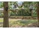 Cozy screened-in porch with comfortable seating and inviting decor, offering a peaceful retreat at 2144 Pinopolis Rd, Pinopolis, SC 29469