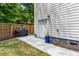 Home exterior features a grill, privacy fence, and concrete pathway along the side of the house at 2159 Parkway Dr, Charleston, SC 29412