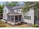 Home's backyard boasts a screened porch and meticulous landscaping, perfect for relaxation and entertaining at 2159 Parkway Dr, Charleston, SC 29412