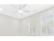 Light-filled bedroom with two shuttered windows and a modern ceiling fan at 2159 Parkway Dr, Charleston, SC 29412