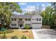 Charming home with a manicured lawn, two-car garage, and inviting front porch, perfect for Southern living at 2159 Parkway Dr, Charleston, SC 29412