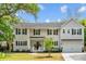Inviting home showcasing a lush front yard, a spacious two-car garage, and charming curb appeal at 2159 Parkway Dr, Charleston, SC 29412