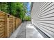 Side yard features gravel drive, privacy fence, and exterior of a well-maintained home at 2159 Parkway Dr, Charleston, SC 29412