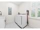 Bright laundry room features a modern washer and dryer with a window bringing in natural light at 2159 Parkway Dr, Charleston, SC 29412