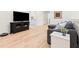 Cozy living room with hardwood floors, a comfortable sofa, and a modern entertainment center at 2159 Parkway Dr, Charleston, SC 29412