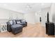 Comfortable living room featuring a plush sectional sofa, hardwood floors, and a ceiling fan at 2159 Parkway Dr, Charleston, SC 29412