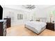Serene main bedroom with neutral decor, hardwood floors, plantation shutters, and generous natural light at 2159 Parkway Dr, Charleston, SC 29412