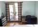 Bedroom with a desk area and access to a balcony through glass doors at 22A Corinne St # 31, Charleston, SC 29403