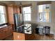 Kitchen featuring an island with black countertop, stainless steel appliances, and hardwood flooring at 22A Corinne St # 31, Charleston, SC 29403