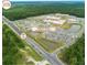 Aerial view of the hospital showing parking, ponds, highway access, and surrounding wooded areas at 221 Lucca Dr, Summerville, SC 29486