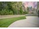 Private backyard featuring a well-maintained lawn, concrete patio, and wood fencing at 221 Lucca Dr, Summerville, SC 29486