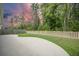 Large backyard features a concrete patio, grassy lawn, and wooden privacy fence at 221 Lucca Dr, Summerville, SC 29486