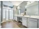 Modern bathroom with double sinks, spacious countertops, and a walk-in shower at 221 Lucca Dr, Summerville, SC 29486