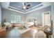 Spacious bedroom featuring a decorative ceiling, ceiling fan, and inviting natural light at 221 Lucca Dr, Summerville, SC 29486