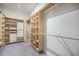 Custom walk-in closet with ample shelving and rods, maximizing storage and organization at 221 Lucca Dr, Summerville, SC 29486