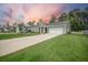 Well-kept home featuring an attached two-car garage and spacious driveway at 221 Lucca Dr, Summerville, SC 29486