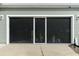 Screened-in garage with white trim provides a flexible indoor/outdoor space at 221 Lucca Dr, Summerville, SC 29486