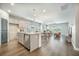 Open-concept kitchen with a large island that flows into the living room and dining area at 221 Lucca Dr, Summerville, SC 29486
