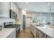 Well-equipped kitchen featuring stainless steel appliances, a large island, and sleek countertops at 221 Lucca Dr, Summerville, SC 29486