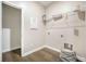 Functional laundry room with wire shelving, tile floors, and washer/dryer hookups at 221 Lucca Dr, Summerville, SC 29486