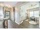Inviting home office featuring a ceiling fan, large window, and sleek wood flooring at 221 Lucca Dr, Summerville, SC 29486