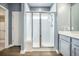 Contemporary shower with glass doors and white tile, offering a clean, modern feel at 221 Lucca Dr, Summerville, SC 29486
