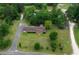 This aerial perspective highlights the home's serene setting, complete with a pond and lush greenery at 228 Dogwood Trl, Harleyville, SC 29448