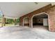 Spacious brick carport featuring ample covered parking and storage space at 228 Dogwood Trl, Harleyville, SC 29448