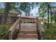 Multi-tiered wooden deck featuring a unique diagonal pattern, offering ample space for outdoor living and entertaining at 228 Dogwood Trl, Harleyville, SC 29448