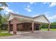 Brick house with a spacious carport and well-maintained surroundings, offering convenient parking and shelter at 228 Dogwood Trl, Harleyville, SC 29448