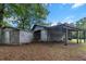 Exterior of a gray cinderblock building with an attached drive-through canopy at 228 Dogwood Trl, Harleyville, SC 29448
