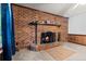 This is a close up of the brick fireplace with mantel and hearth at 228 Dogwood Trl, Harleyville, SC 29448