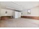 Spacious garage with brick flooring, storage, and a side entrance at 228 Dogwood Trl, Harleyville, SC 29448