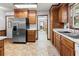 Bright kitchen featuring stainless steel appliances, a double sink, and wood cabinetry at 228 Dogwood Trl, Harleyville, SC 29448