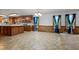 View of the open floor plan, with kitchen and its wooden cabinets in the background at 228 Dogwood Trl, Harleyville, SC 29448