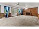 Bright living room with brick fireplace, ceiling fans, and access to the backyard at 228 Dogwood Trl, Harleyville, SC 29448