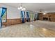 Spacious living room with brick fireplace, natural light, and open floor plan at 228 Dogwood Trl, Harleyville, SC 29448