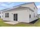 Backyard view of a home with a patio and sliding glass door for indoor-outdoor living at 244 Wild Strawberry Ln, Moncks Corner, SC 29461