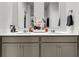 Modern bathroom featuring double sinks, gray cabinetry, and neutral countertop at 244 Wild Strawberry Ln, Moncks Corner, SC 29461